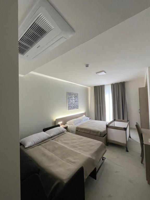 Postel nebo postele na pokoji v ubytování Hotel Diadema