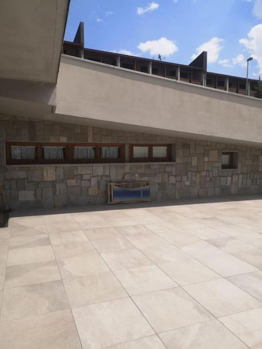 a large building with windows on the side of it at Appartamento Cristallo Vicino alle piste in Sestriere
