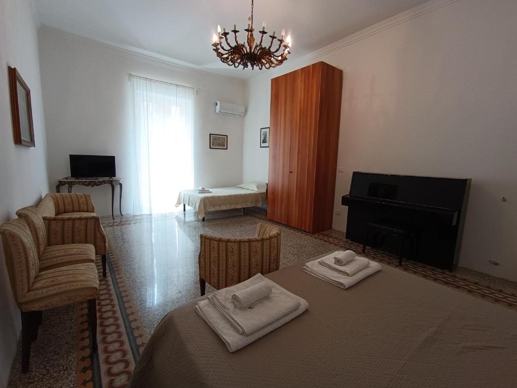 Postel nebo postele na pokoji v ubytování Il Genio del Porto - Mabbonath b&b