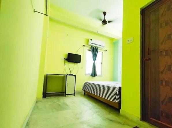Postel nebo postele na pokoji v ubytování Amar priya guest house