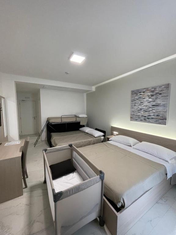 Postel nebo postele na pokoji v ubytování Hotel Diadema