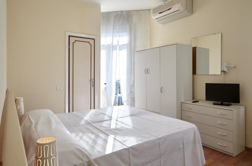 Postel nebo postele na pokoji v ubytování Hotel Mirage