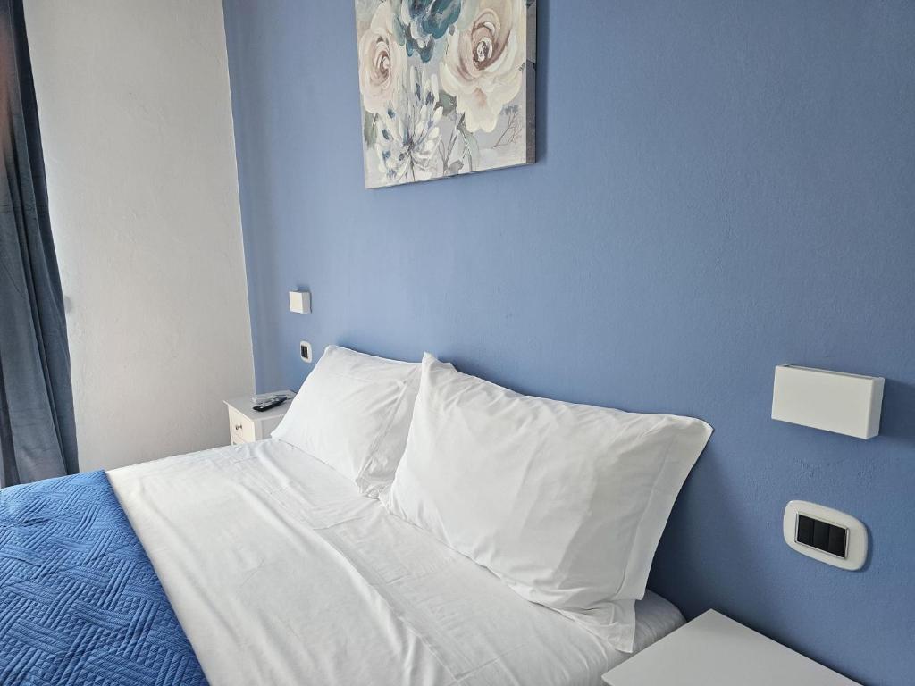 Postel nebo postele na pokoji v ubytování Appartamento Azzurro Mare