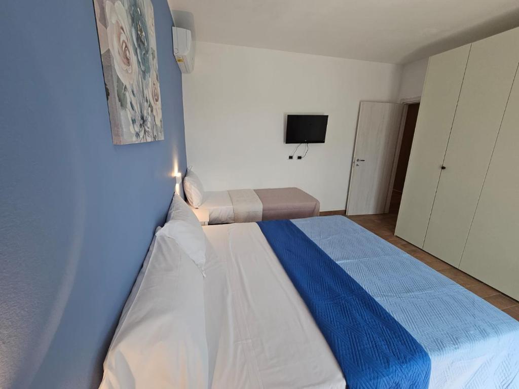 Postel nebo postele na pokoji v ubytování Appartamento Azzurro Mare