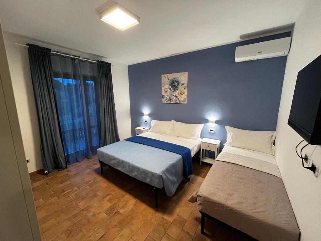 Postel nebo postele na pokoji v ubytování Appartamento Azzurro Mare