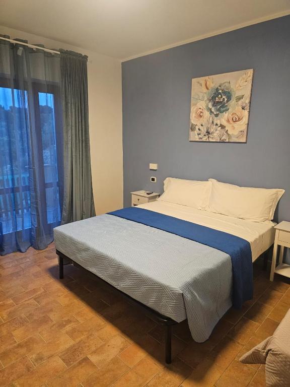 Postel nebo postele na pokoji v ubytování Appartamento Azzurro Mare