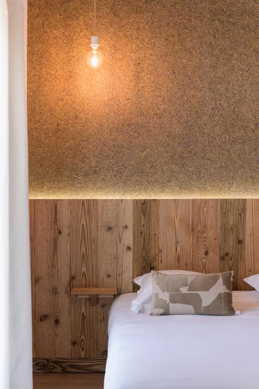 Postel nebo postele na pokoji v ubytování Hôtel Maison Doron