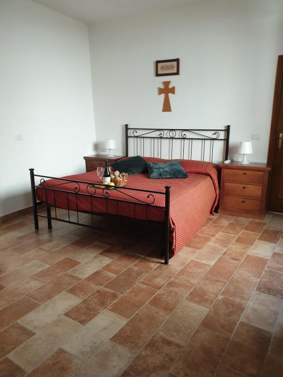 Postel nebo postele na pokoji v ubytování Locanda Francescana