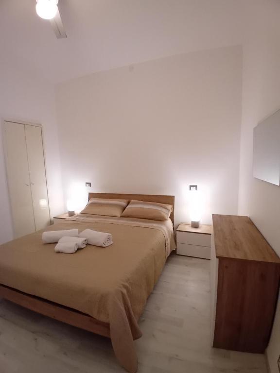 Postel nebo postele na pokoji v ubytování AS House