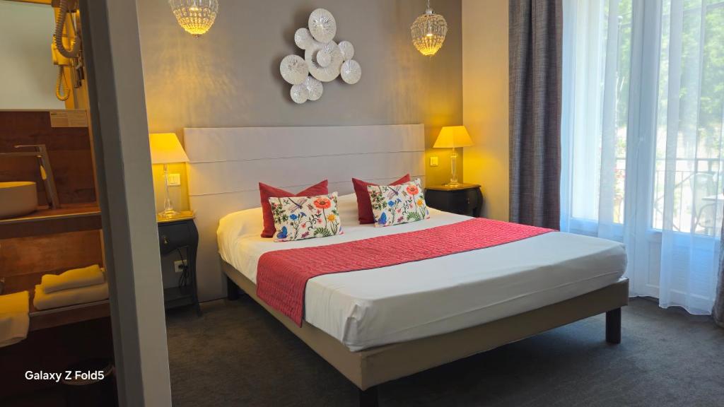 Postel nebo postele na pokoji v ubytování Brit Hotel Acacias