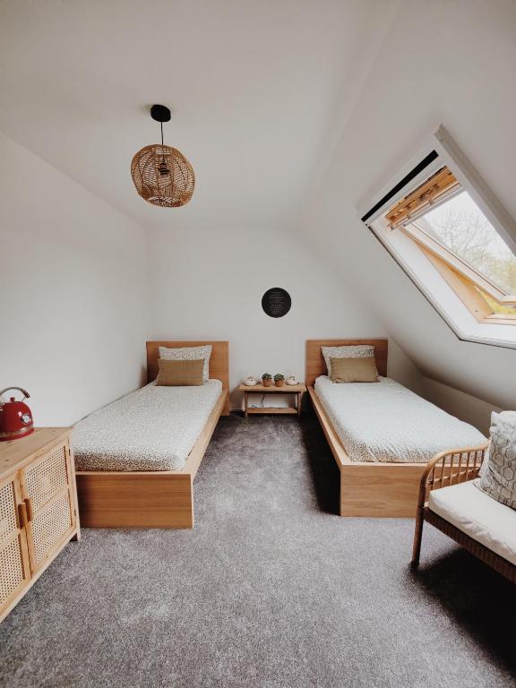 Postel nebo postele na pokoji v ubytování B&B Wijdzicht