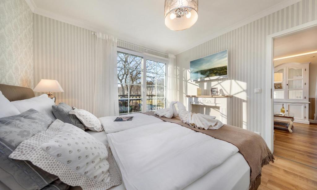 Postel nebo postele na pokoji v ubytování Villa Strandblick Villa Strandblick 11