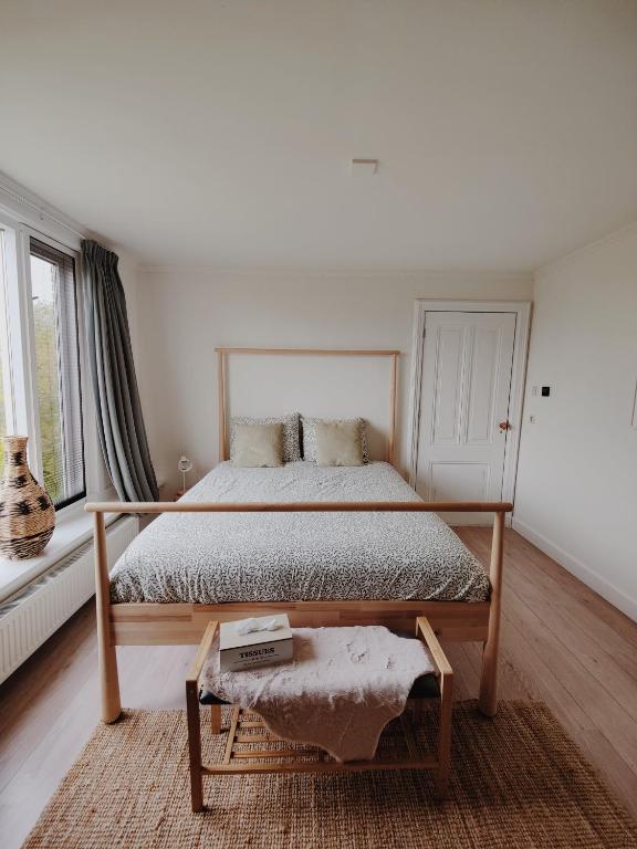Postel nebo postele na pokoji v ubytování B&B Wijdzicht