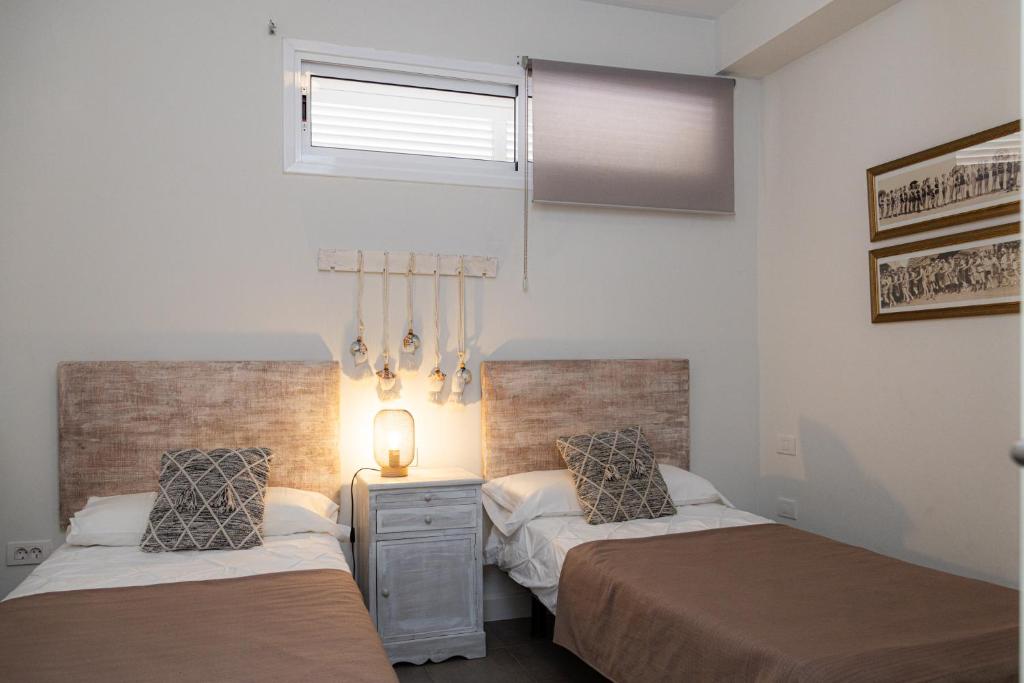 A bed or beds in a room at Vistas al Mar junto a la Playa 3D