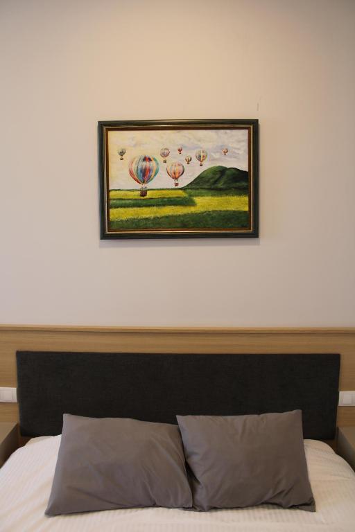 Postel nebo postele na pokoji v ubytování MD Apartmants