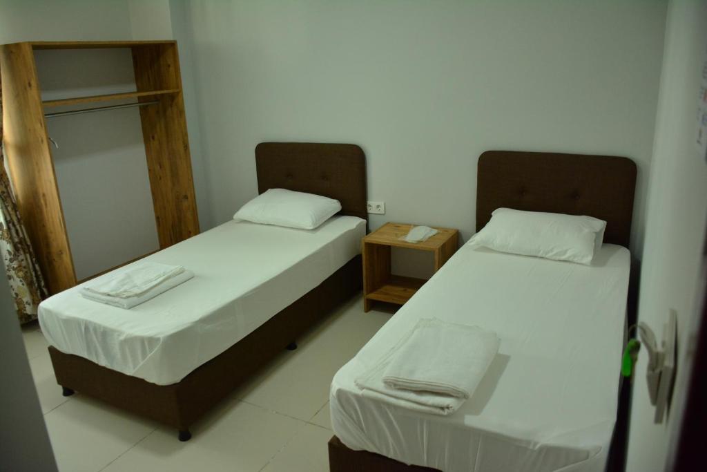 Postel nebo postele na pokoji v ubytování Yeşilyurt otel