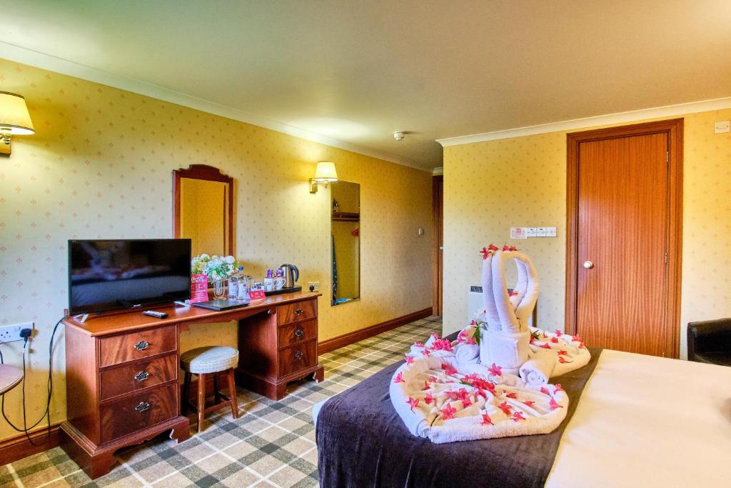 TV a/nebo společenská místnost v ubytování Muthu Ben Doran Hotel