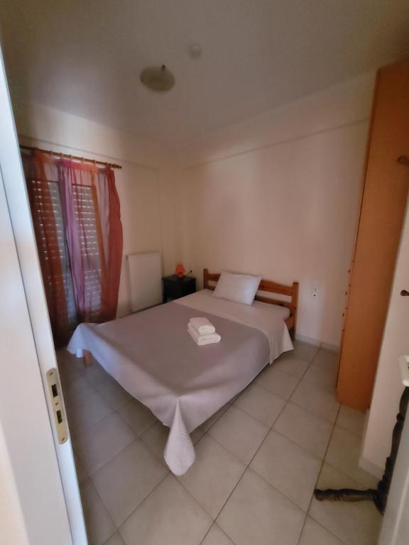 Posteľ alebo postele v izbe v ubytovaní Ostria Seaside Apartments