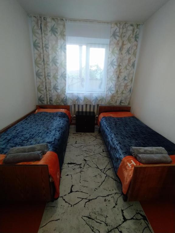 Postel nebo postele na pokoji v ubytování guest house twins