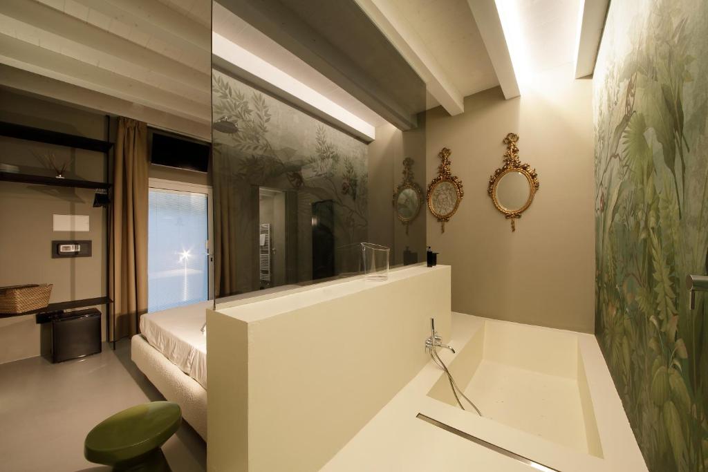 Postel nebo postele na pokoji v ubytování ISONZO SUITES