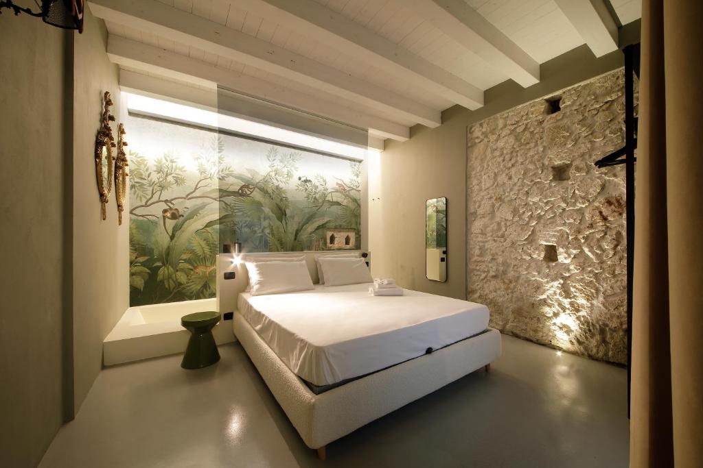 Postel nebo postele na pokoji v ubytování ISONZO SUITES