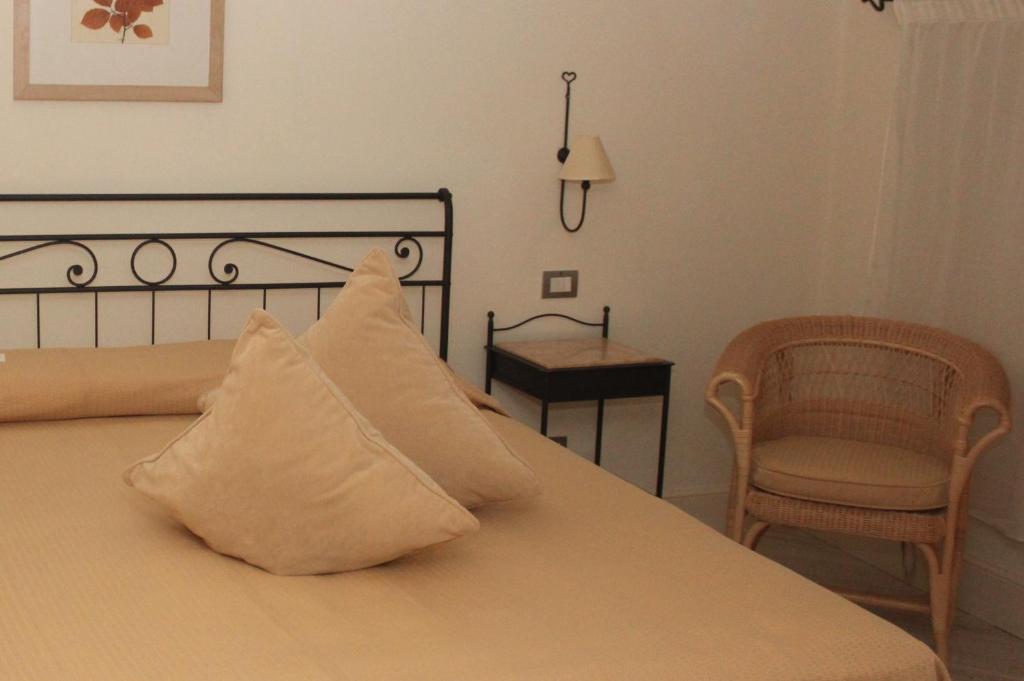 Postel nebo postele na pokoji v ubytování Hotel Sirolo