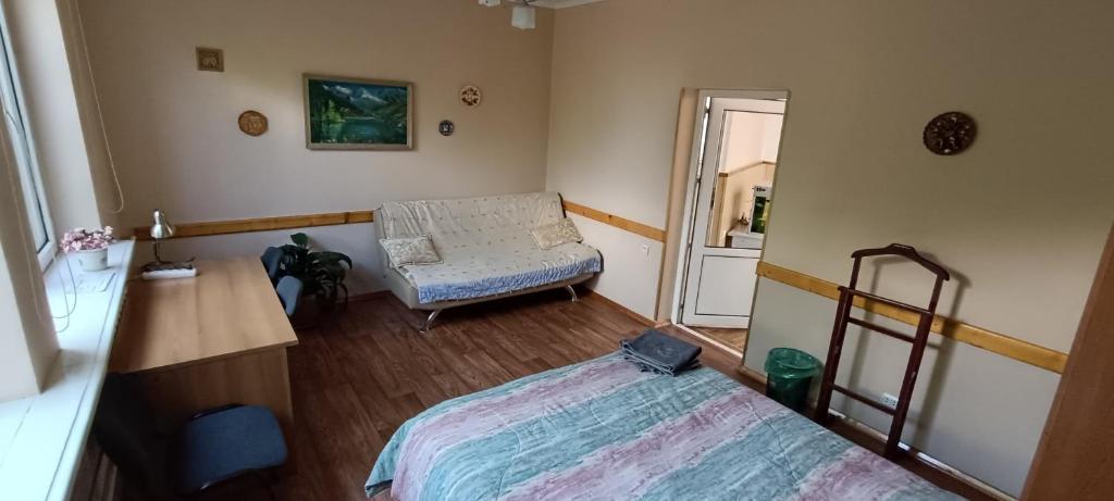 Postel nebo postele na pokoji v ubytování Tian-Shan Guest House