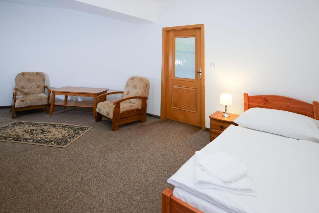 Postel nebo postele na pokoji v ubytování Hrad Krupka