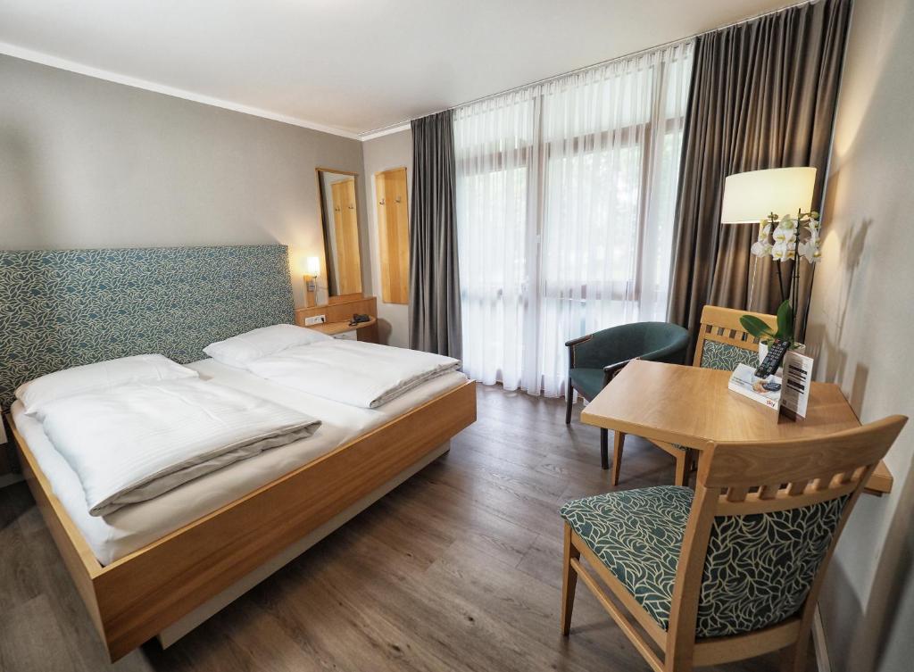 Postel nebo postele na pokoji v ubytování City Appartementhotel
