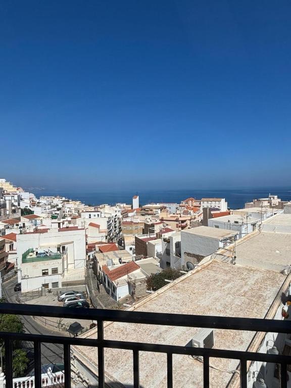 a view of a city from a balcony at La Cuesta House in Castell de Ferro