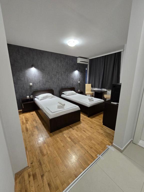 Postel nebo postele na pokoji v ubytování Apartments Philip II