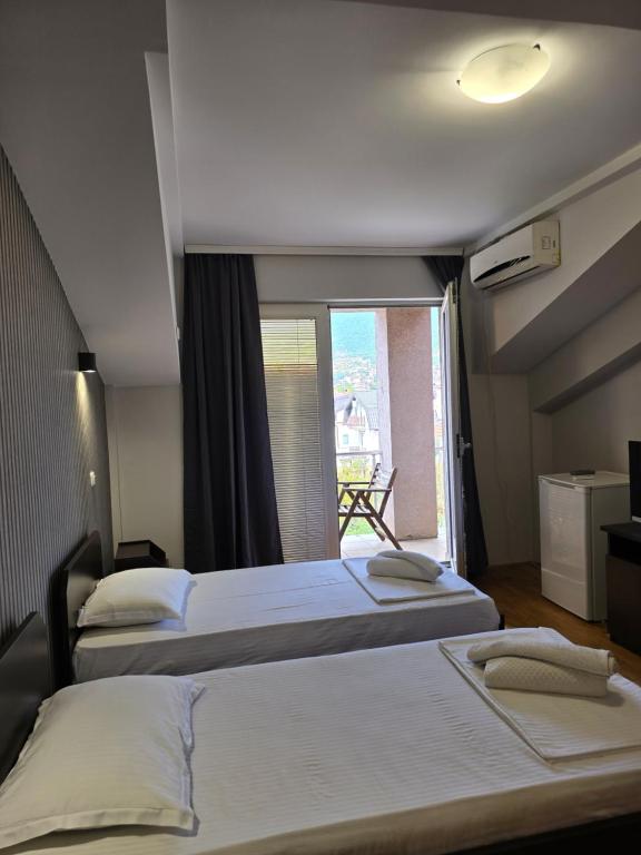 Postel nebo postele na pokoji v ubytování Apartments Philip II