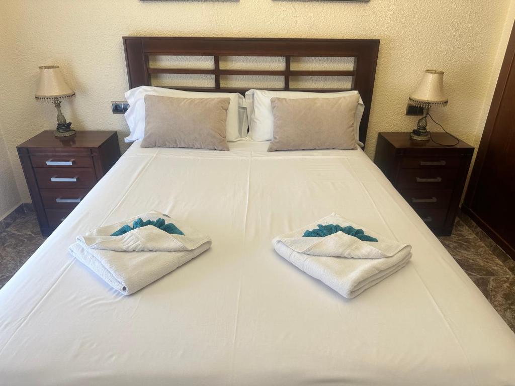 Posteľ alebo postele v izbe v ubytovaní Homely Apartments Centro