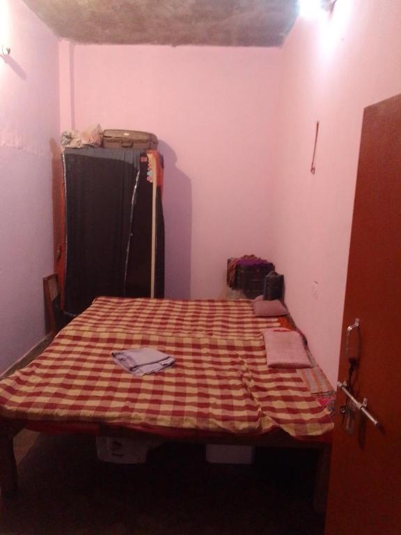 Ένα ή περισσότερα κρεβάτια σε δωμάτιο στο Vaishya Niwas