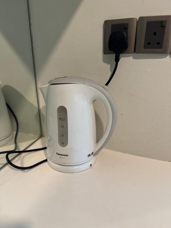 a coffee maker plugged into an electrical outlet at Vortex Suites Klcc 2bedroom & 3bedroom apartment in Kuala Lumpur