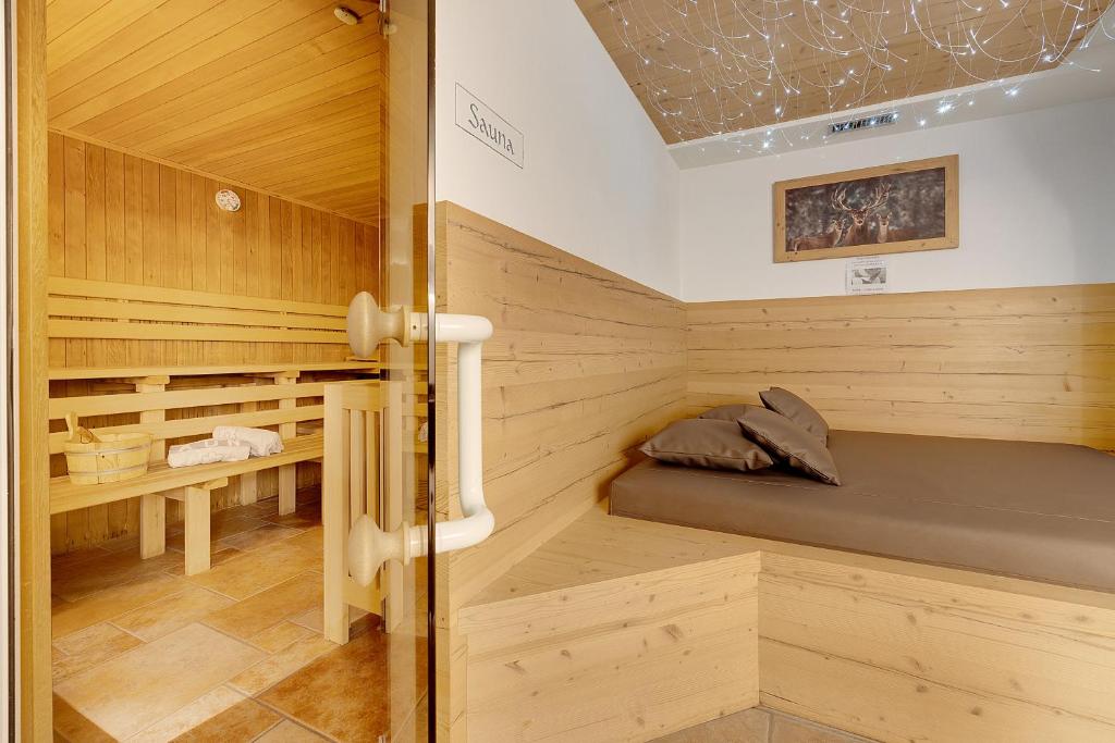 Postel nebo postele na pokoji v ubytování Aparthotel Majestic