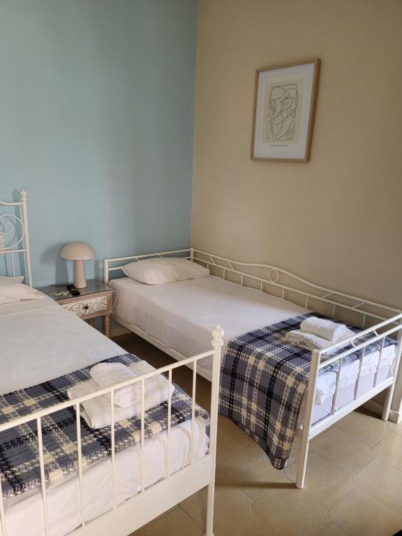 A bed or beds in a room at Margarita rooms
