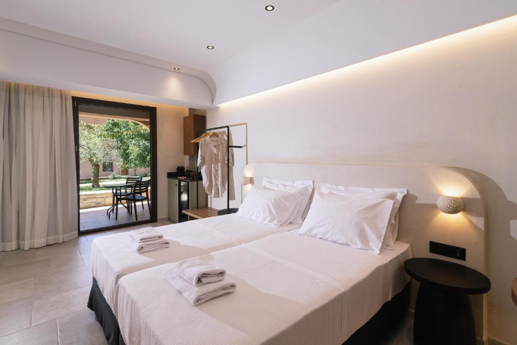 Postel nebo postele na pokoji v ubytování Idi Hotel