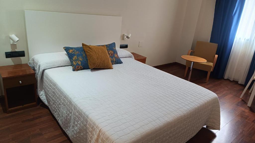 Postel nebo postele na pokoji v ubytování Hotel Suite Camarena
