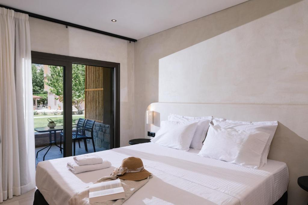 Postel nebo postele na pokoji v ubytování Idi Hotel