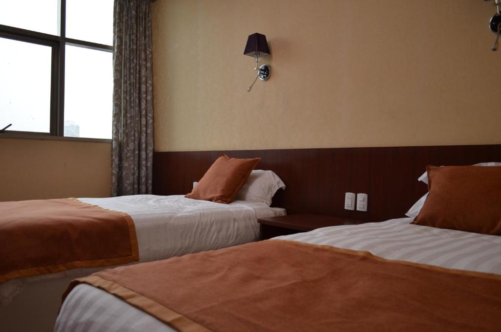Postel nebo postele na pokoji v ubytování Hotel 198