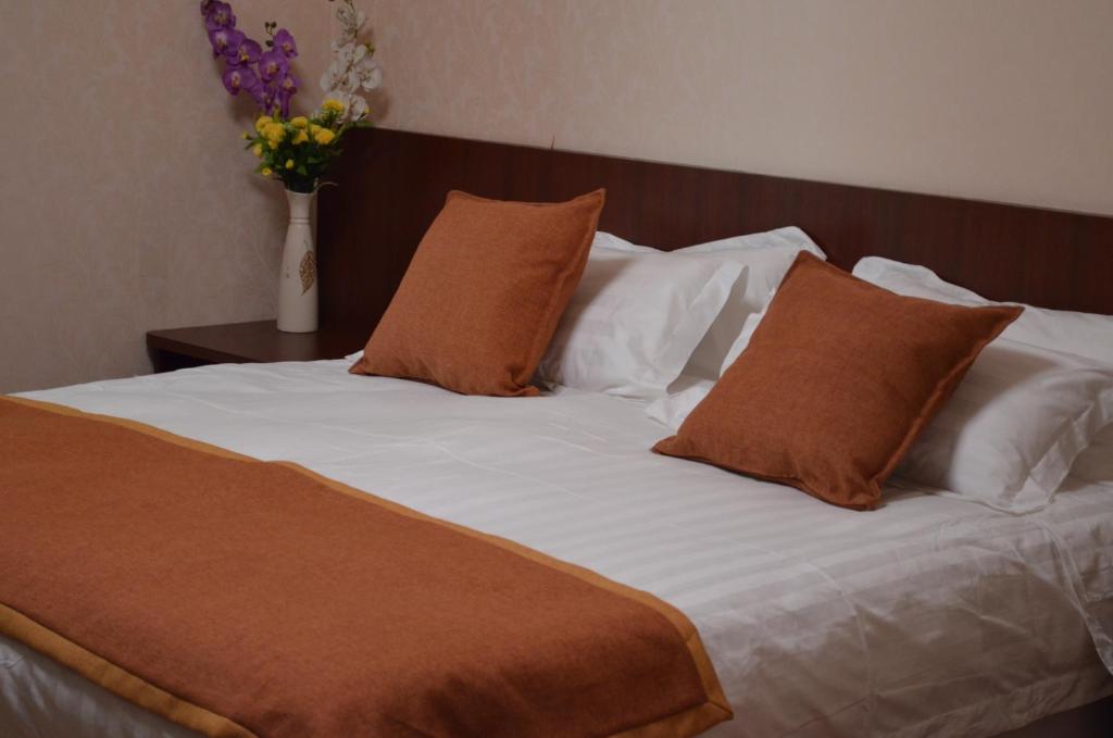Postel nebo postele na pokoji v ubytování Hotel 198