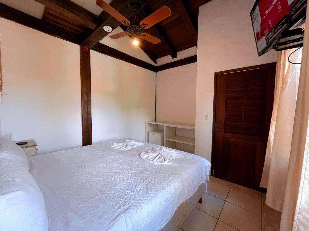 Cama ou camas em um quarto em Pousada Vila do Sol Juquehy