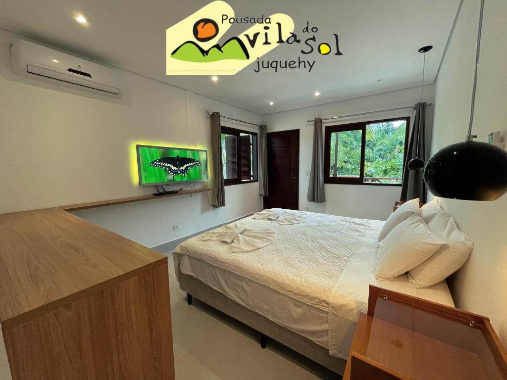 Cama ou camas em um quarto em Pousada Vila do Sol Juquehy