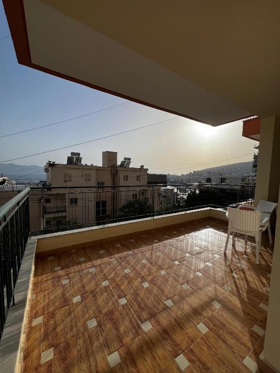 a balcony with a view of a city at Drilon Apartment in Sarandë