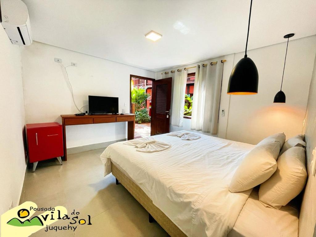 Cama ou camas em um quarto em Pousada Vila do Sol Juquehy