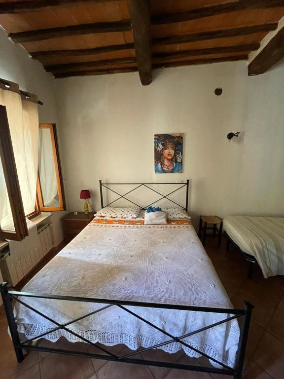 Postel nebo postele na pokoji v ubytování LA STREGA UBRIACA