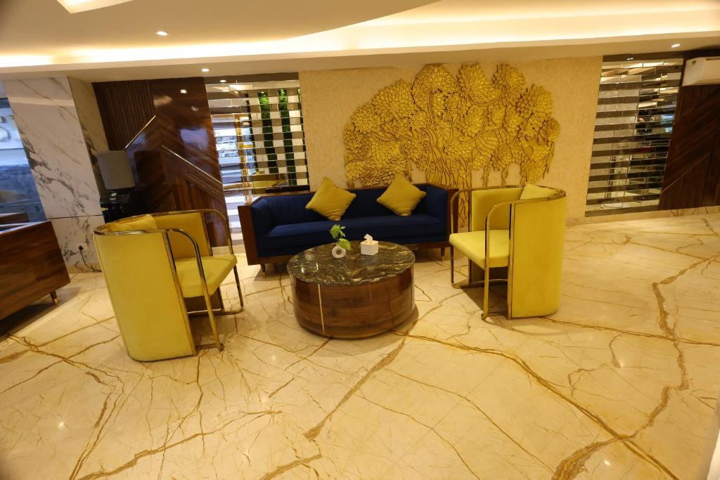 Uma área de estar em Airport Hotel Ramhan Palace Mahipalpur