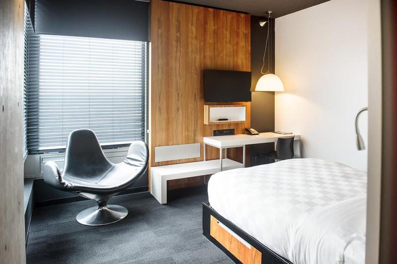 Postel nebo postele na pokoji v ubytování Hôtel Alt Quartier DIX30