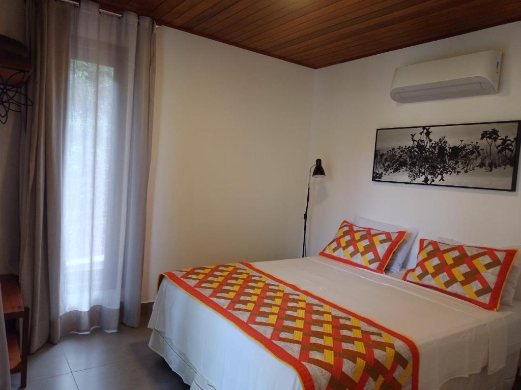 Postel nebo postele na pokoji v ubytování Pousada Casa Viva a Vida